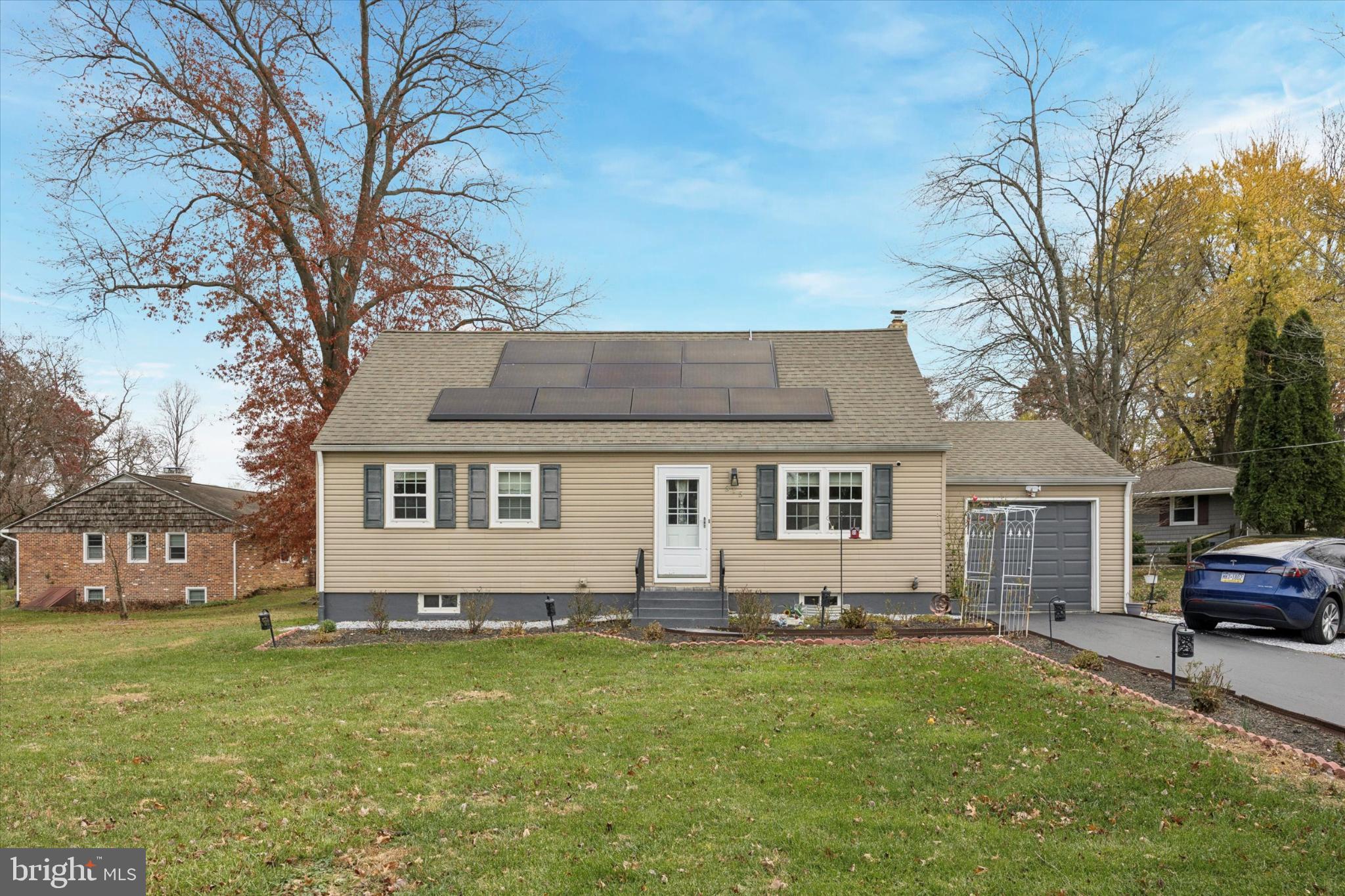 315 Oak Lane West Exton, PA 19341 - Photo 1 of 15 a front view of a house with a garden