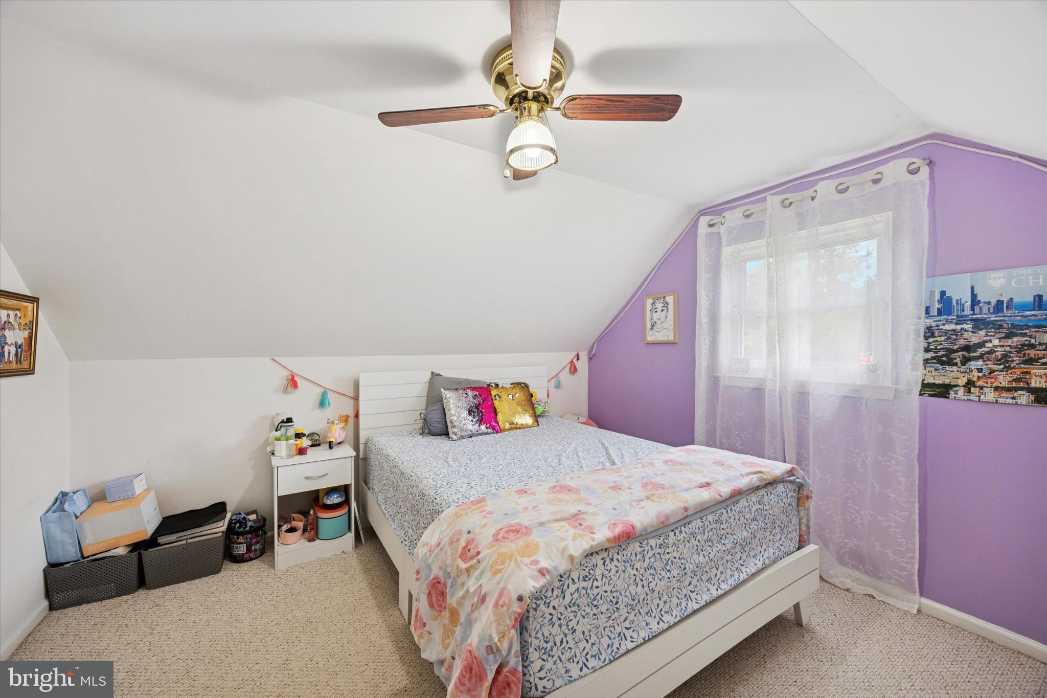 315 Oak Lane West Exton, PA 19341 - Photo 11 of 15 a bedroom with a bed and a chandelier