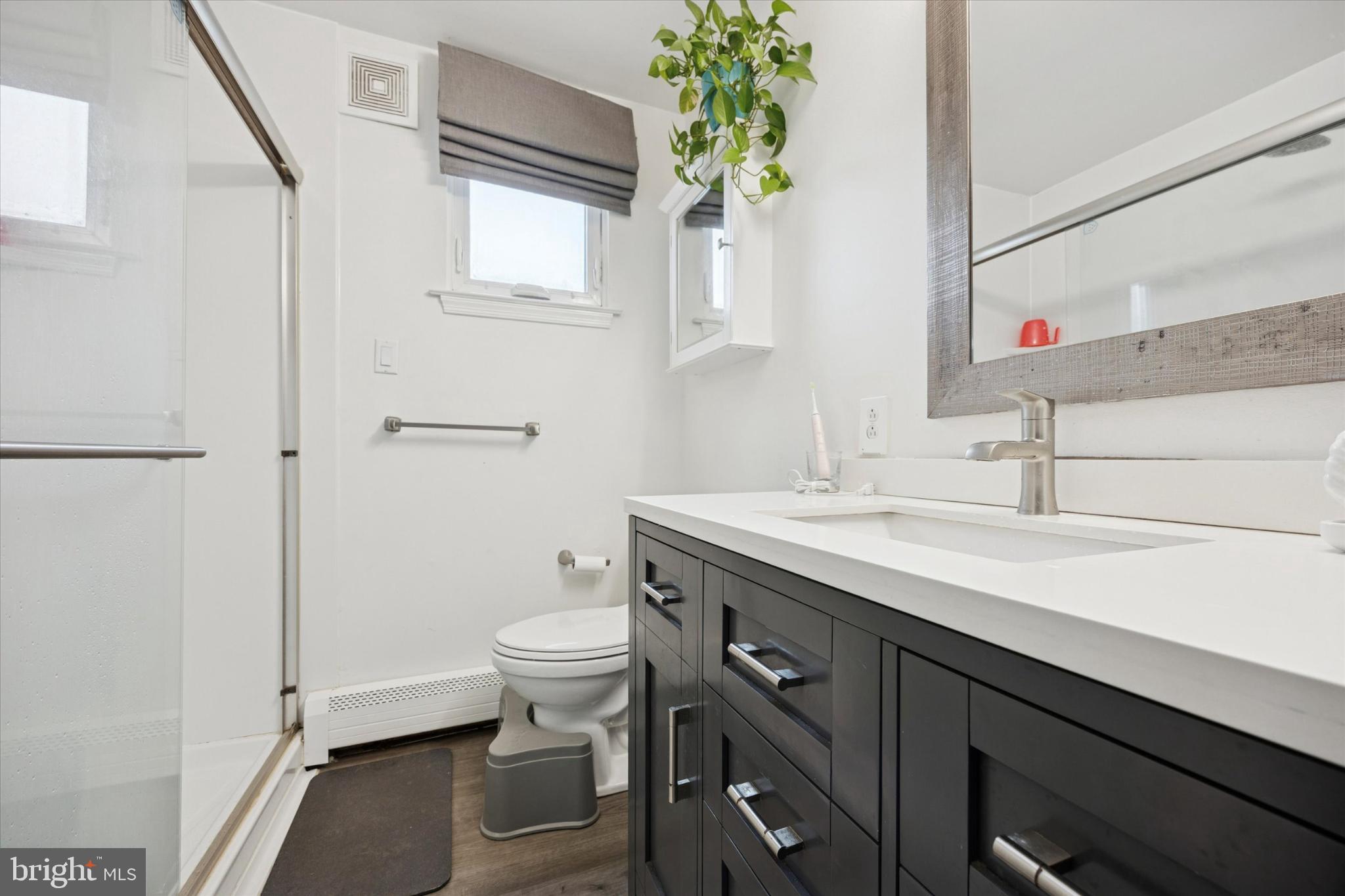 315 Oak Lane West Exton, PA 19341 - Photo 9 of 15 a bathroom with a toilet sink and mirror