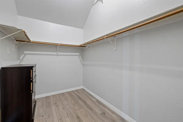 a view of an empty walk in closet