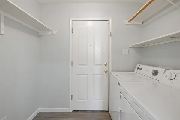 a view of storage and utility room with washer and dryer