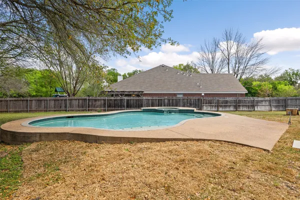 a view of swimming pool with a yard