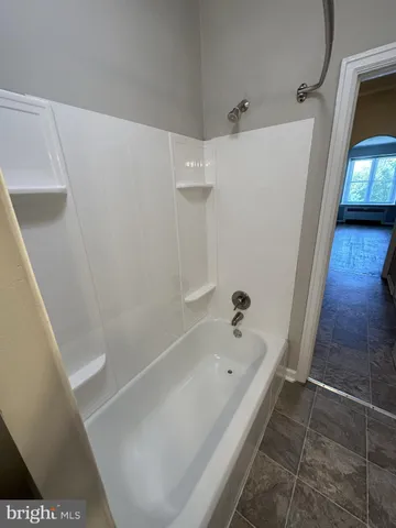 a bathroom with a bathtub