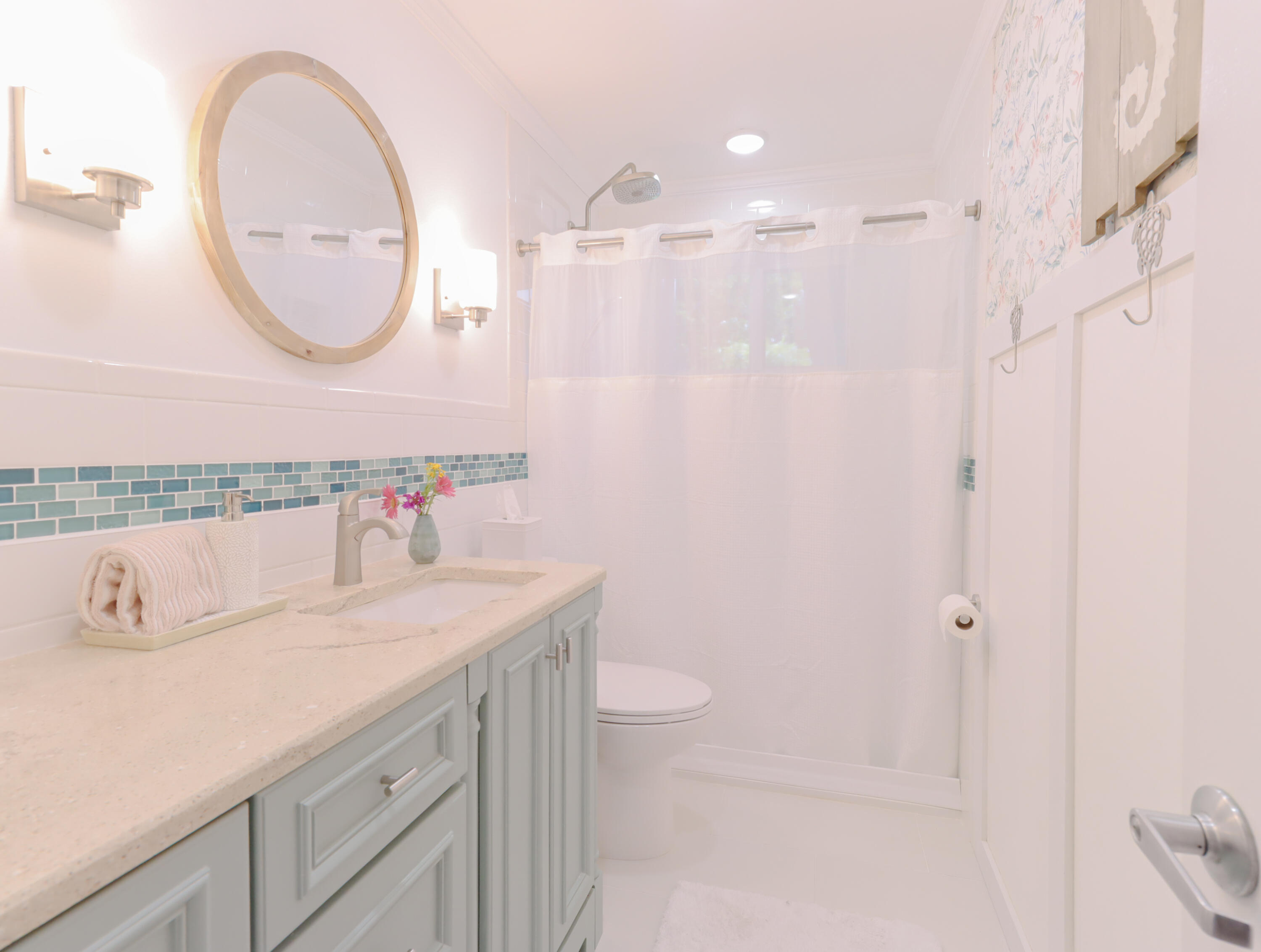 160 Ridge Street Tavernier, FL 33070 - Photo 11 of 25 a bathroom with a sink a toilet and a mirror