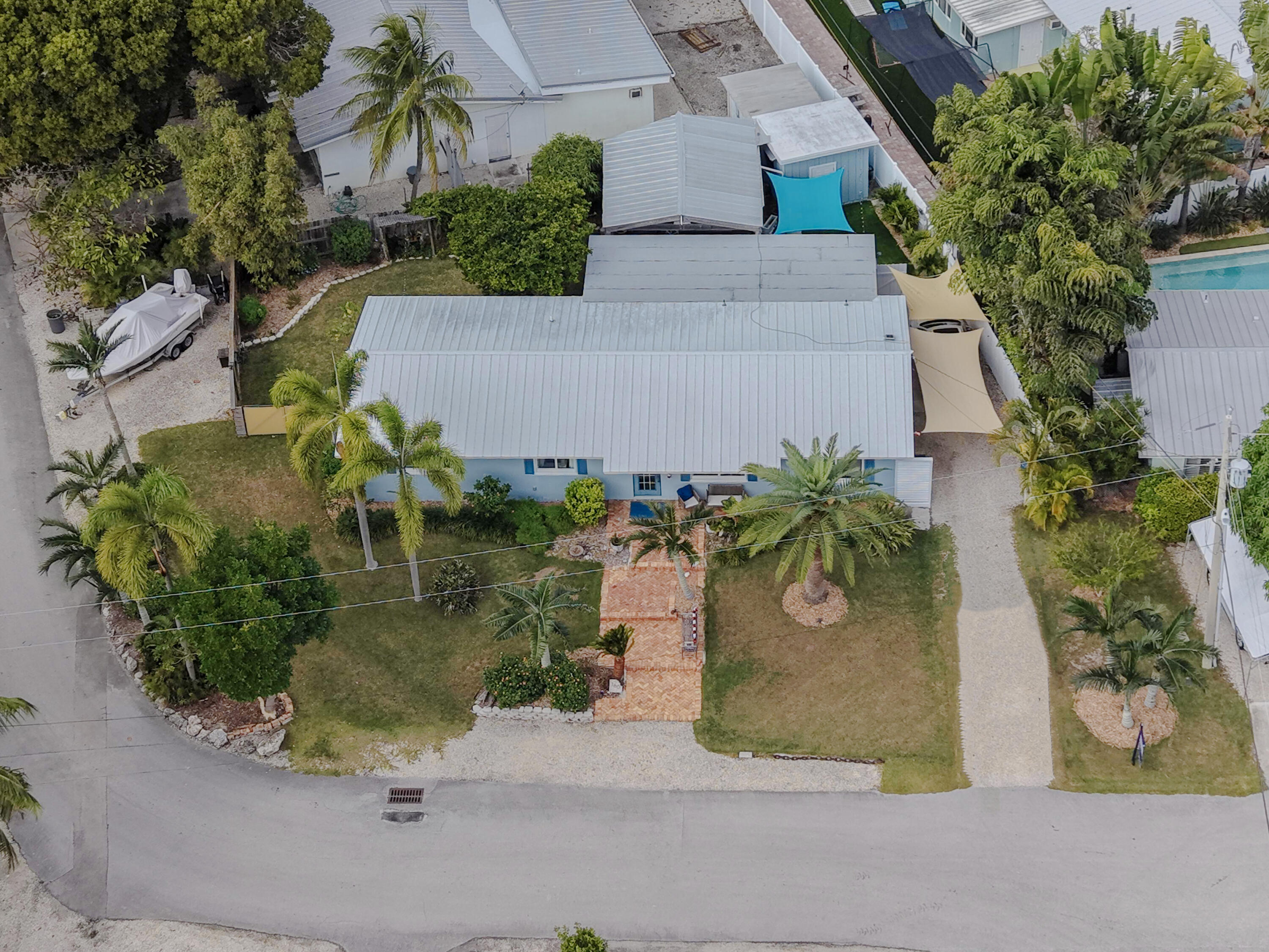160 Ridge Street Tavernier, FL 33070 - Photo 23 of 25 an aerial view of a house with a yard and a garden