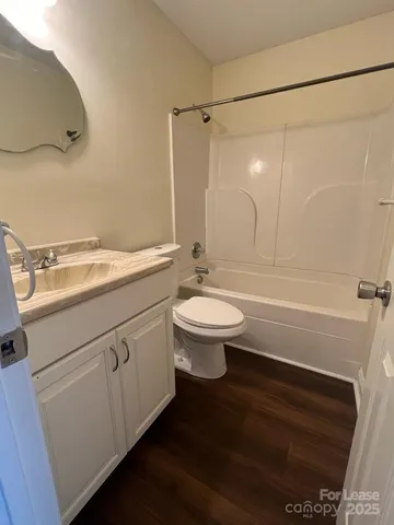 a bathroom with a sink a toilet and a bathtub