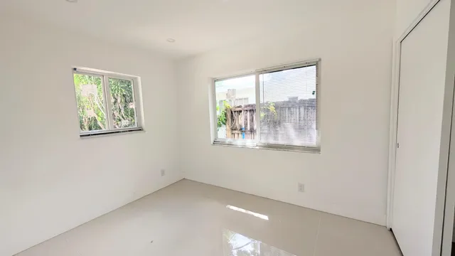 an empty room with windows
