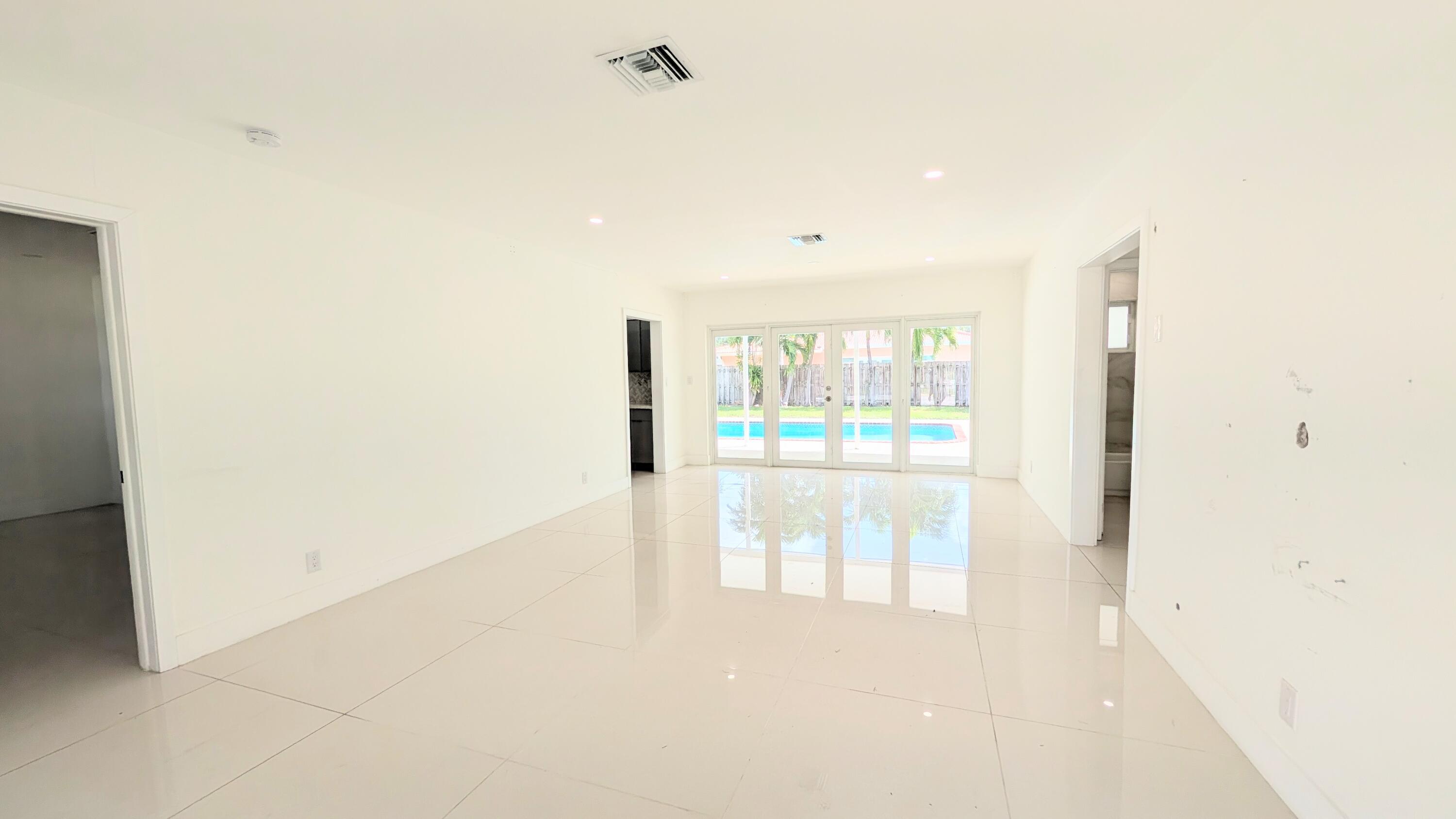 3840 Northeast 22nd Terrace Lighthouse Point, FL 33064 - Photo 2 of 18 a view of entryway with wooden floor