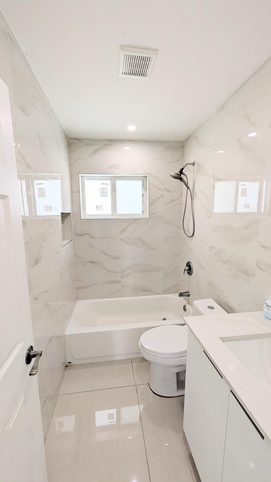 3840 Northeast 22nd Terrace Lighthouse Point, FL 33064 - Photo 7 of 18 a bathroom with a sink a toilet and shower