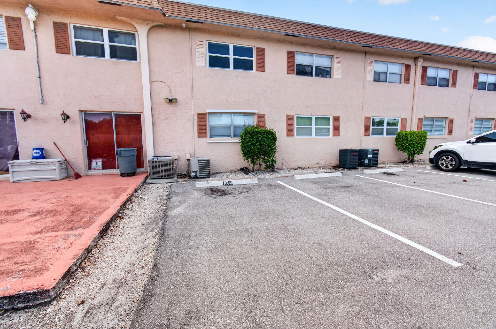 550 Southwest 2nd Avenue, Unit 125 Boca Raton, FL 33432 - Photo 15 of 18 a view of a house with a patio