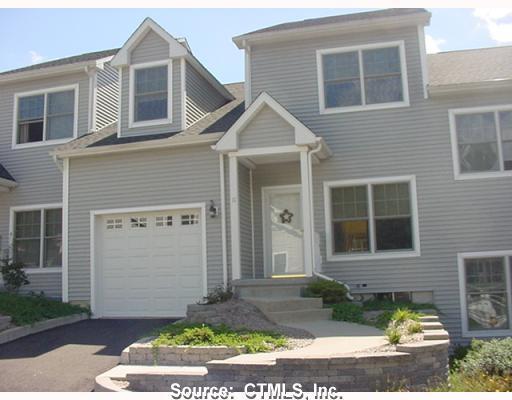 375 Allyn Street, Unit 17 Groton, CT 06355 - Photo 1 of 1 a front view of a house with garden