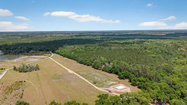a view of a lake with a yard