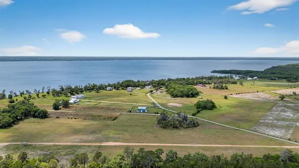 a view of a lake with a building in the background