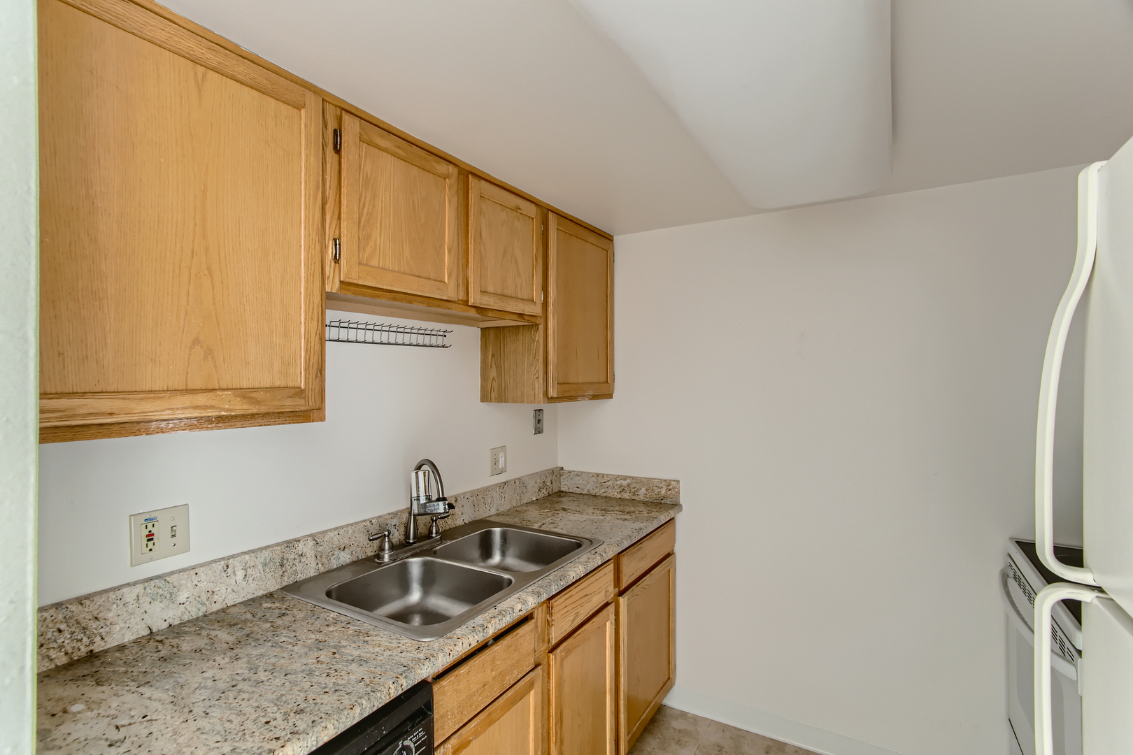 1 Renaissance Place, Unit 411 Palatine, IL 60067 - Photo 3 of 10 a kitchen with stainless steel appliances granite countertop a sink stove and refrigerator