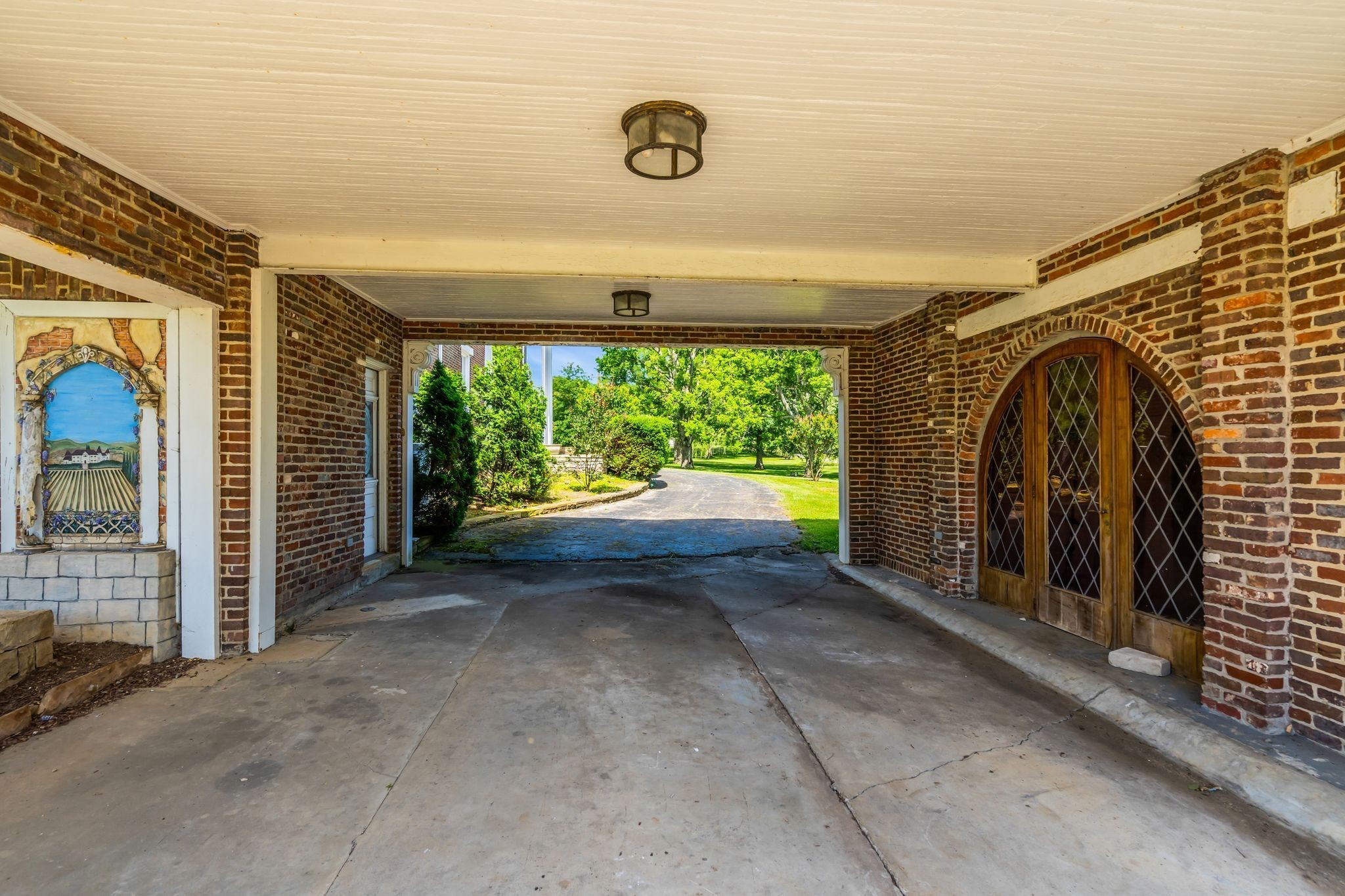 1112 Franklin Road Brentwood, TN 37027 - Photo 27 of 68 a view of a room with sliding door and wooden floor