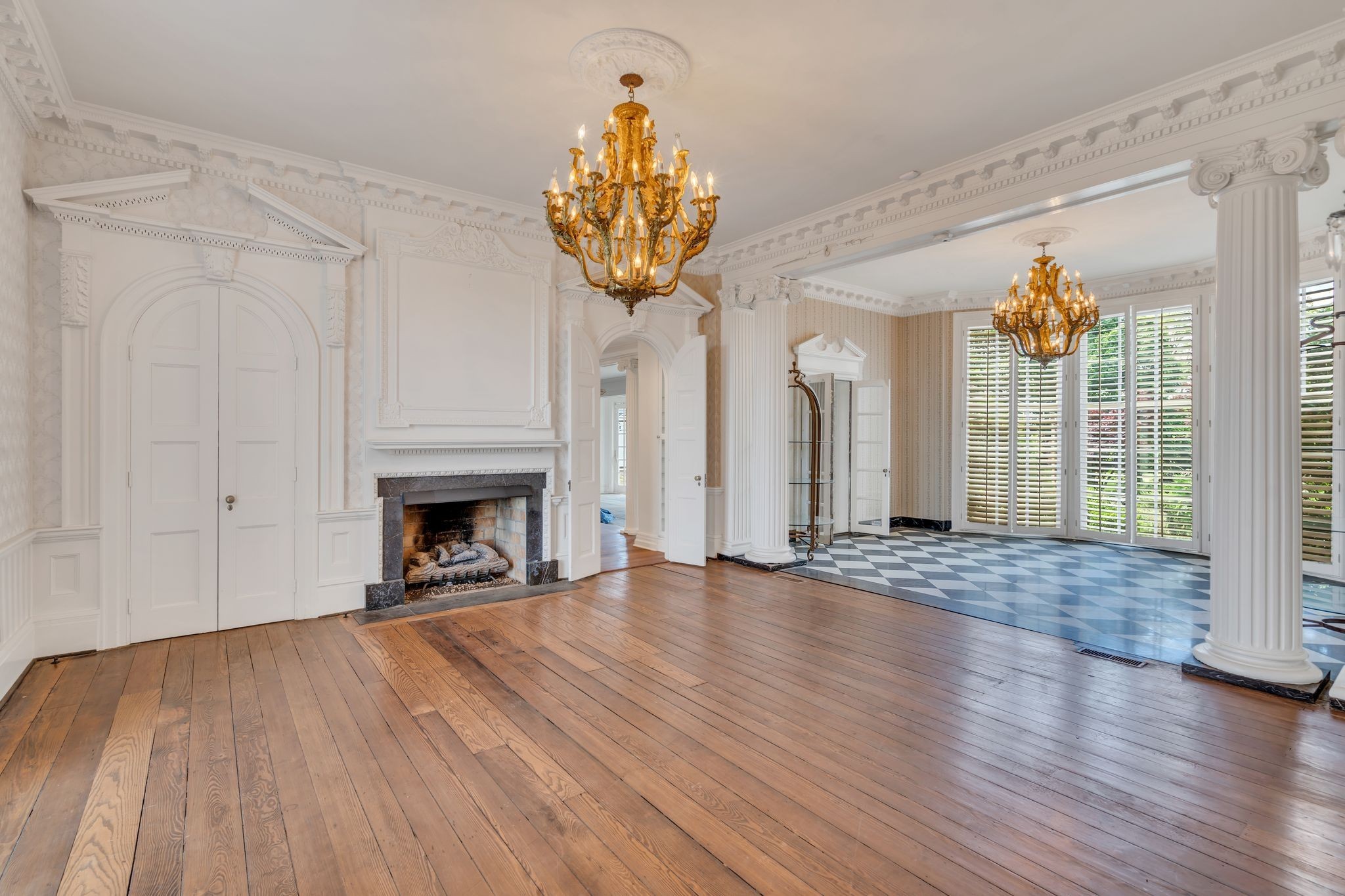 1112 Franklin Road Brentwood, TN 37027 - Photo 44 of 68 a view of an empty room with wooden floor and a fireplace