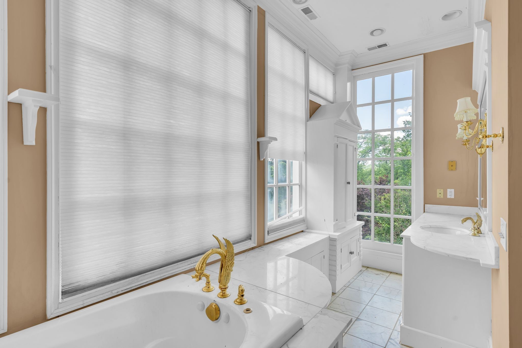 1112 Franklin Road Brentwood, TN 37027 - Photo 54 of 68 a bathroom with a tub a sink and a window
