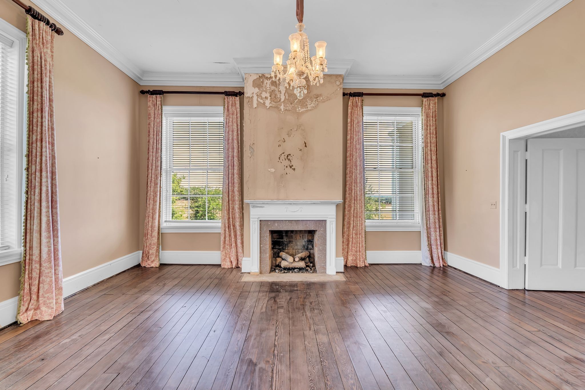 1112 Franklin Road Brentwood, TN 37027 - Photo 58 of 68 an empty room with wooden floor fireplace and windows