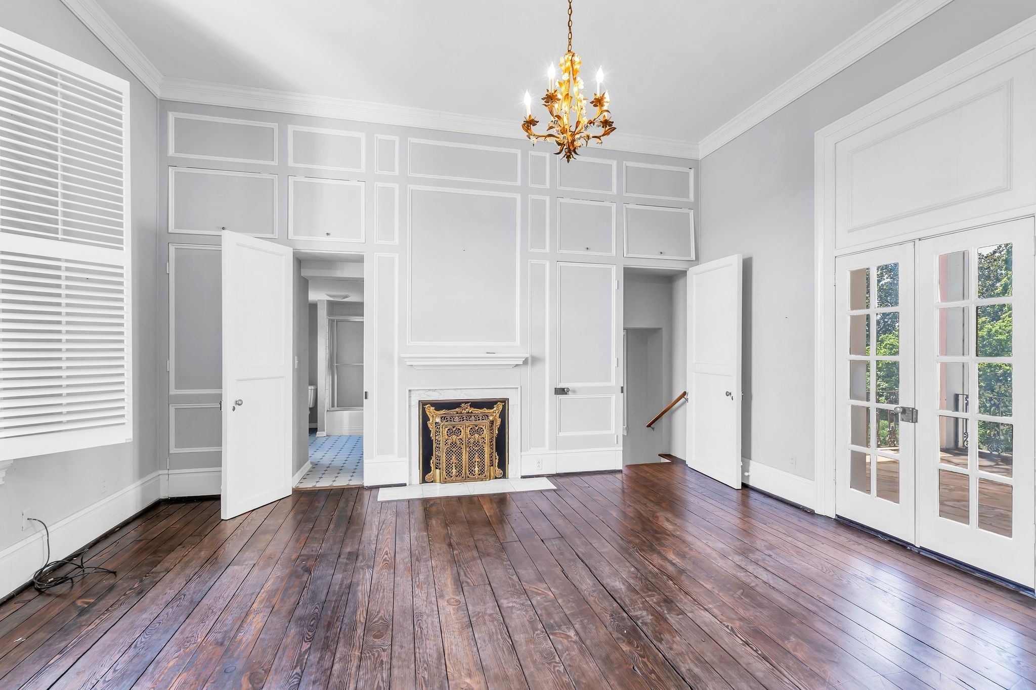 1112 Franklin Road Brentwood, TN 37027 - Photo 60 of 68 an empty room with wooden floor fireplace and windows