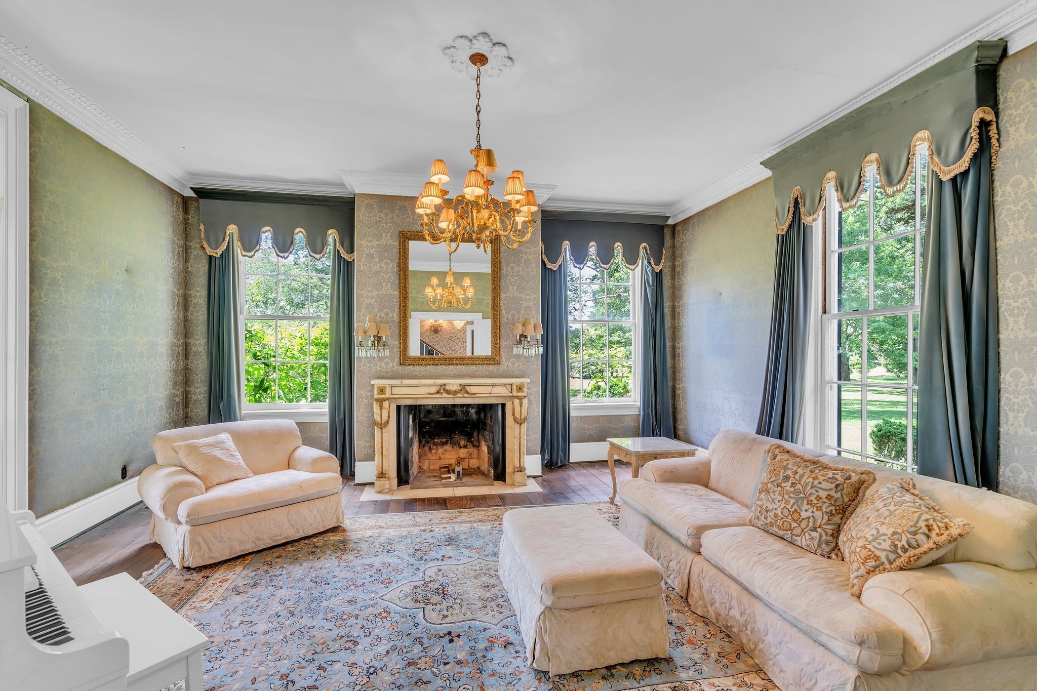 1112 Franklin Road Brentwood, TN 37027 - Photo 65 of 68 a living room with furniture a fireplace and a chandelier