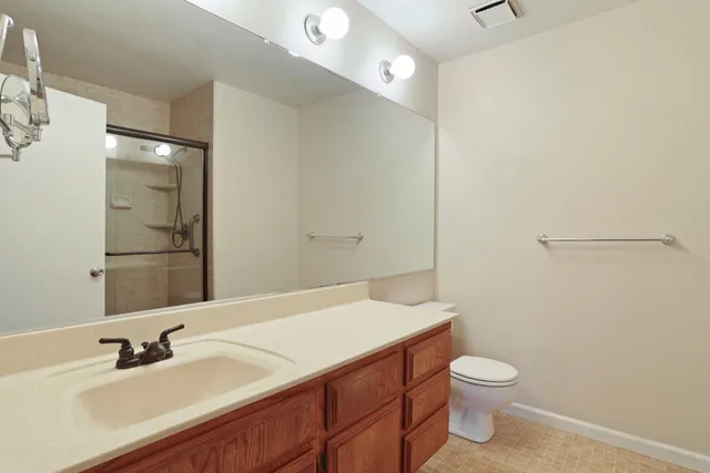 a bathroom with a glass shower door