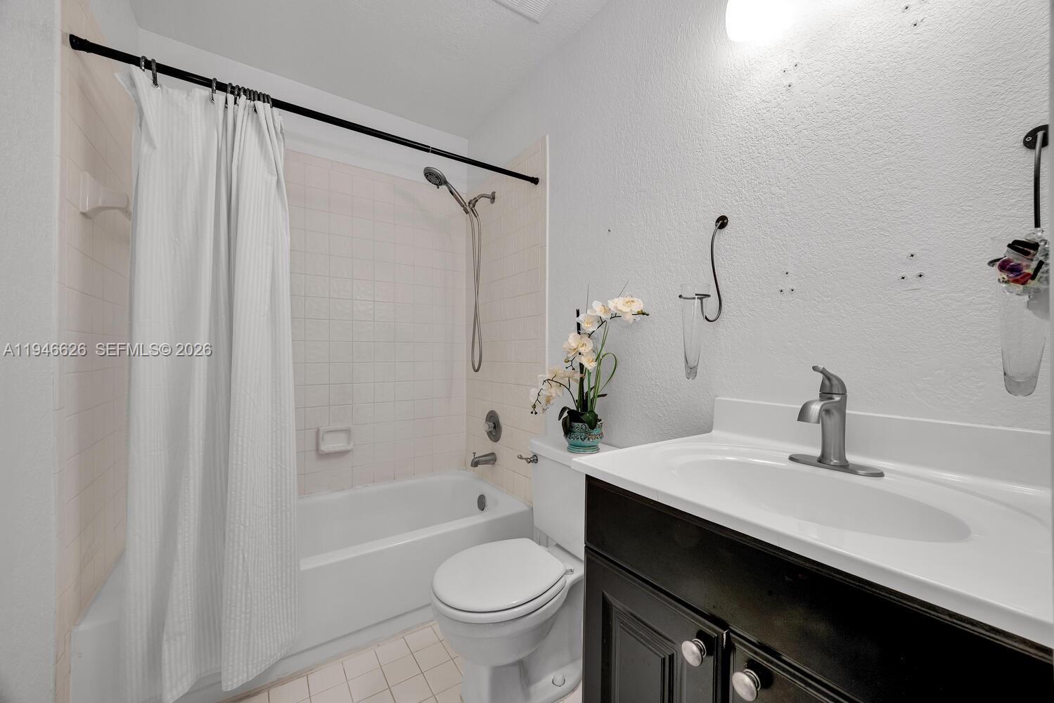 13121 Southwest 95th Avenue Miami, FL 33176 - Photo 13 of 41 a bathroom with a sink toilet and shower