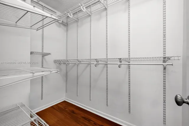 a view of a storage & utility room with wooden floor