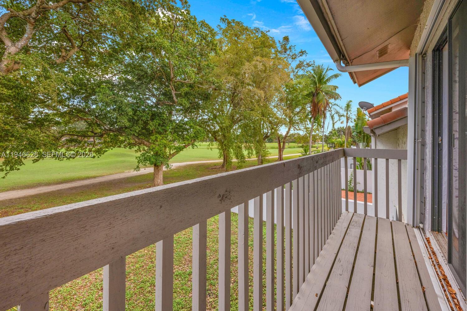 13121 Southwest 95th Avenue Miami, FL 33176 - Photo 15 of 41 a view of a balcony with wooden floor
