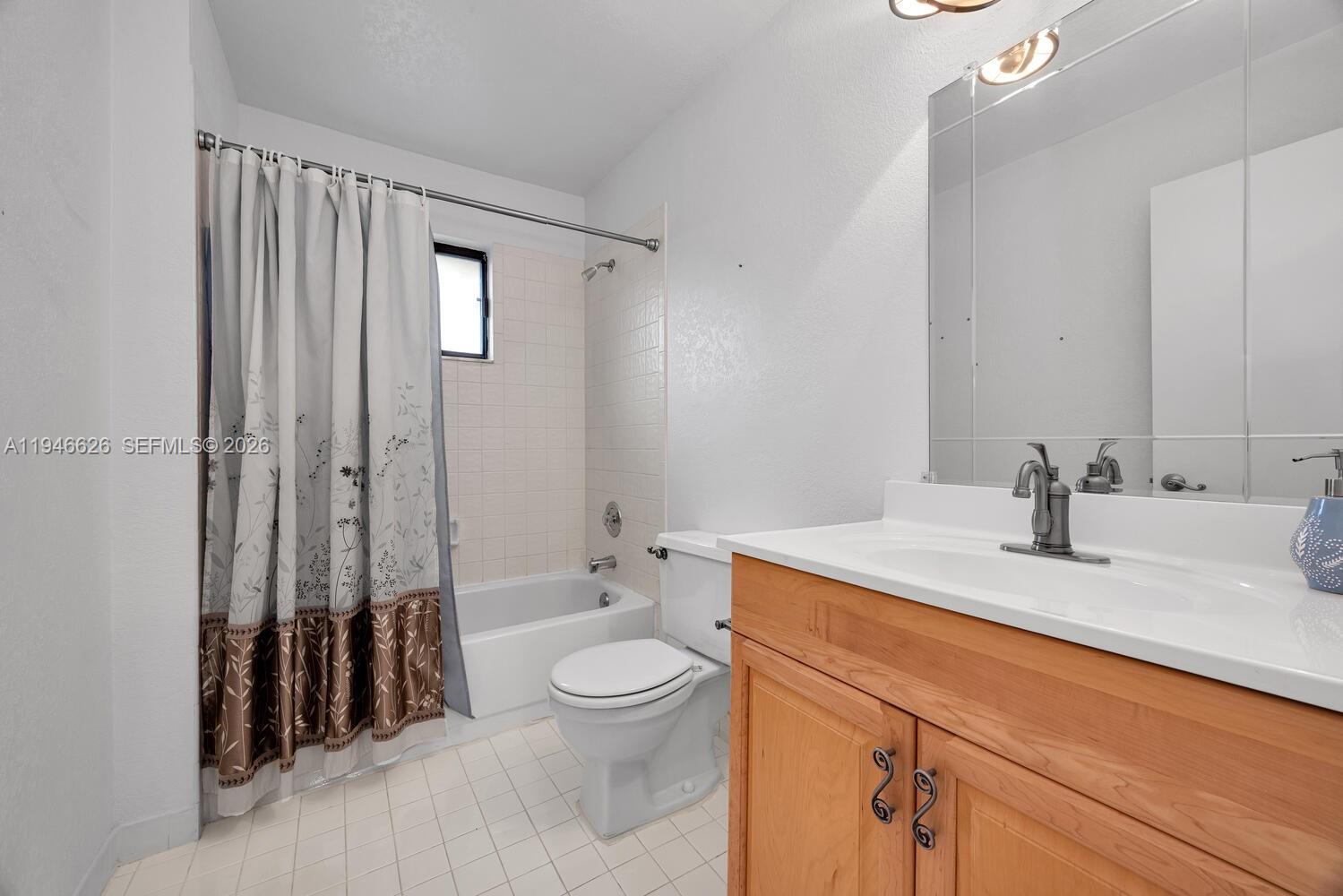 13121 Southwest 95th Avenue Miami, FL 33176 - Photo 18 of 41 a bathroom with a sink a toilet and shower