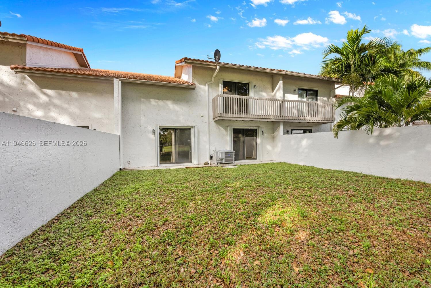 13121 Southwest 95th Avenue Miami, FL 33176 - Photo 23 of 41 a view of a house with a yard