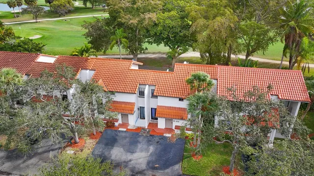 aerial view of a house with a yard