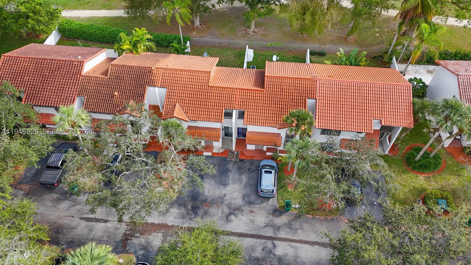 13121 Southwest 95th Avenue Miami, FL 33176 - Photo 36 of 41 a view of a patio with plants and trees