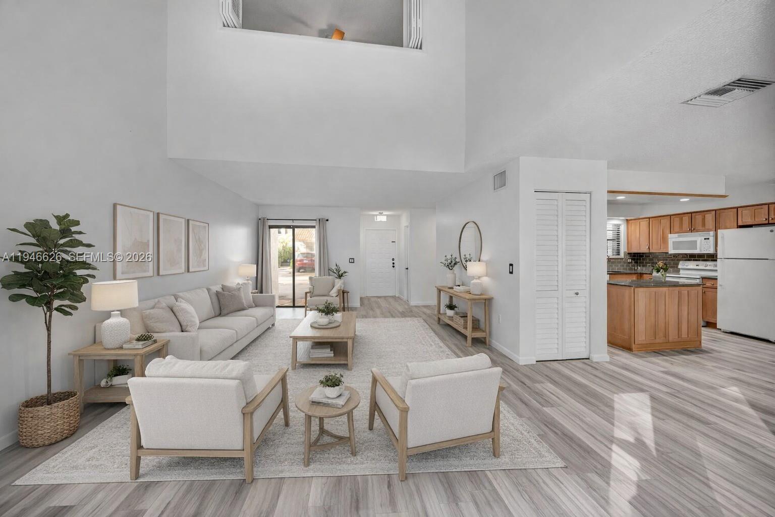 13121 Southwest 95th Avenue Miami, FL 33176 - Photo 4 of 41 a living room with furniture and a large window