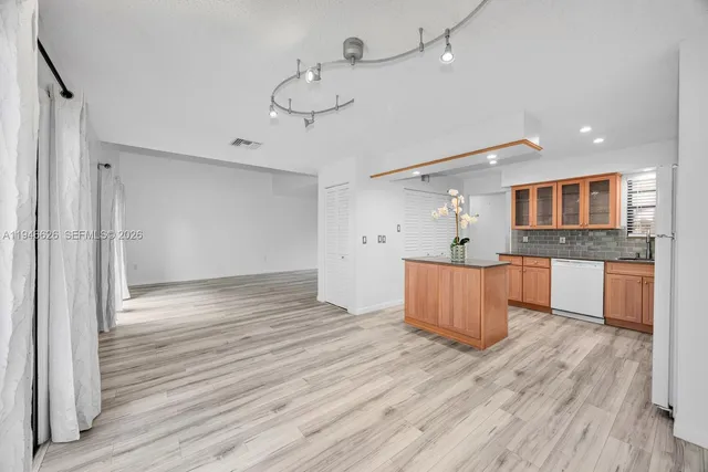 a view of kitchen and wooden floor