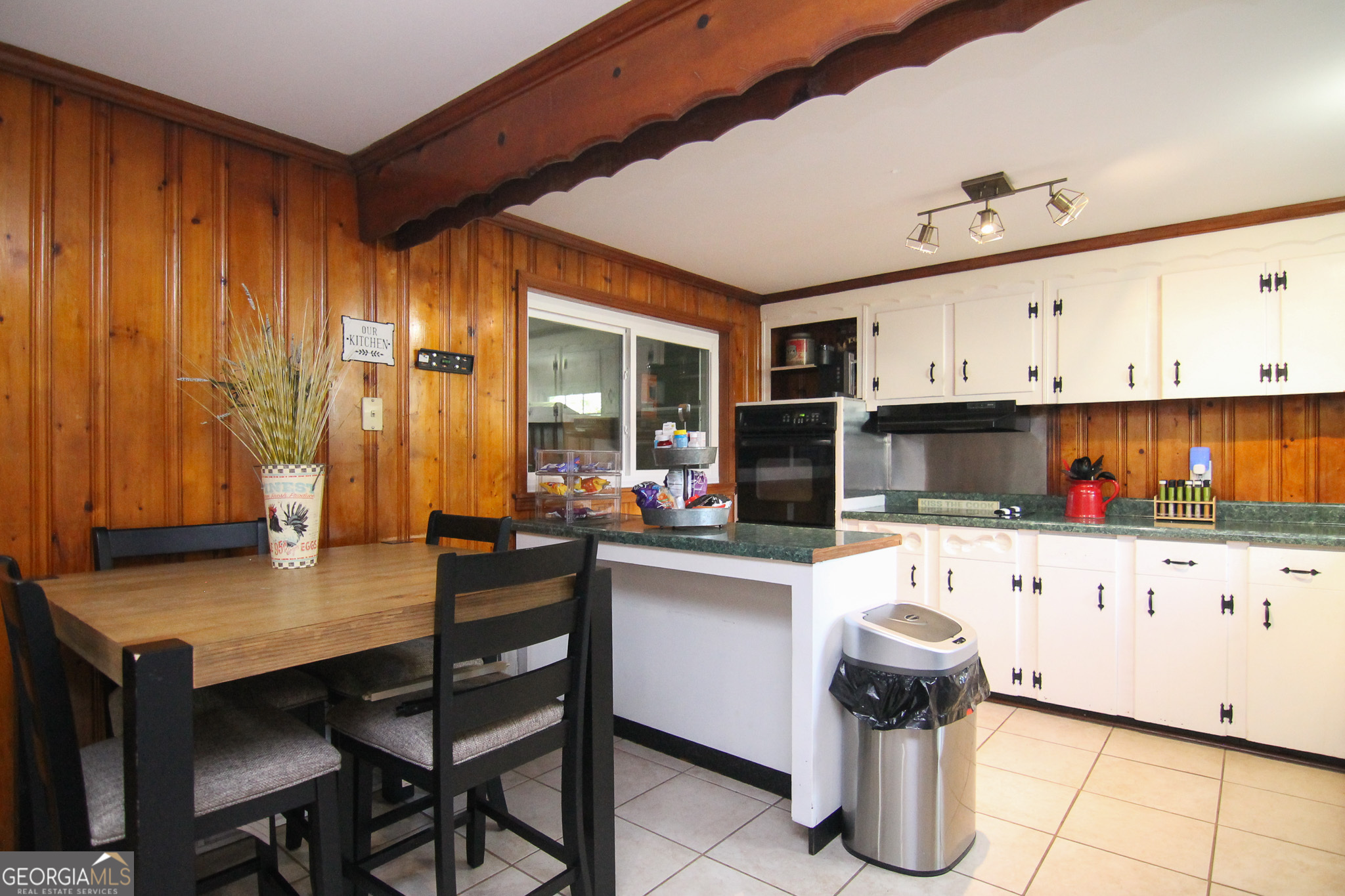 113 Pearce Drive Warner Robins, GA 31093 - Photo 12 of 27 a kitchen with sink cabinets and microwave