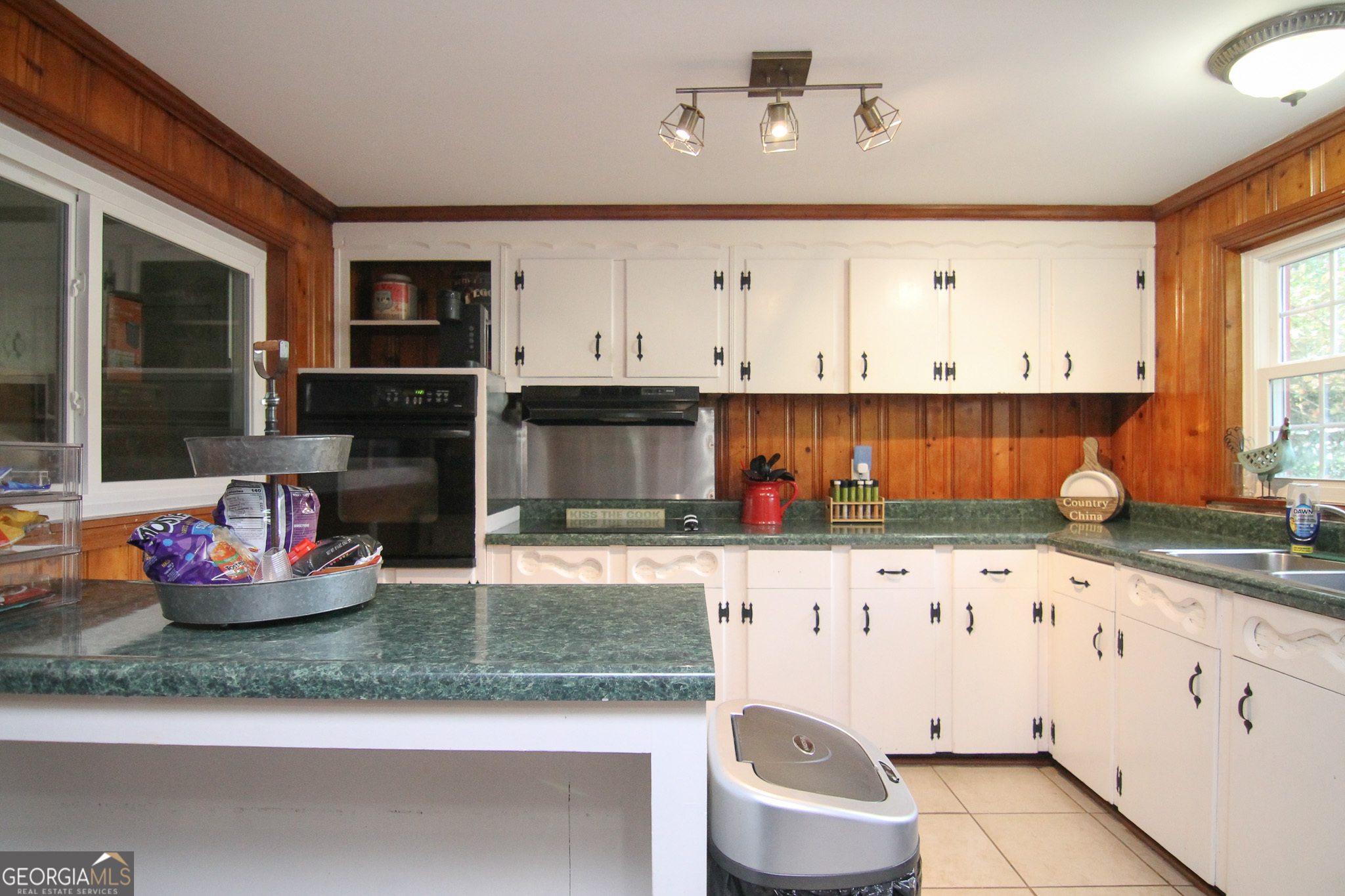 113 Pearce Drive Warner Robins, GA 31093 - Photo 13 of 27 a kitchen with granite countertop white cabinets and stainless steel appliances
