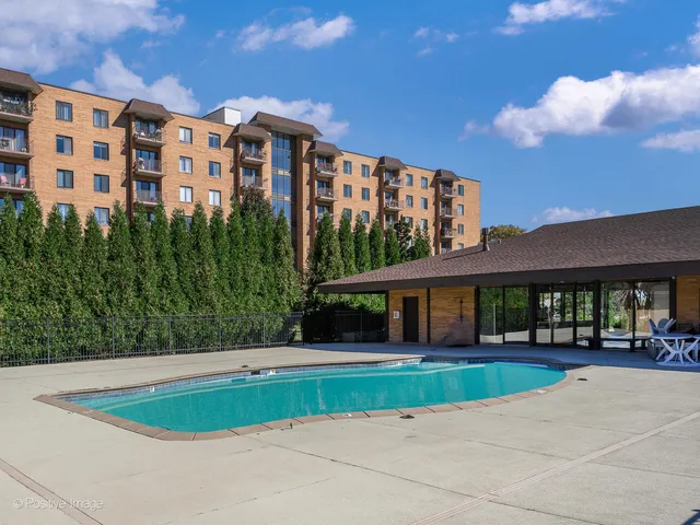 a front view of a building with a garden