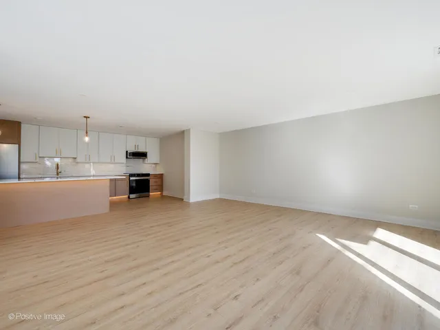 a view of kitchen with wooden floor