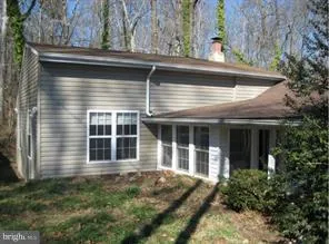 a view of house with trees