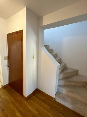 an empty room with wooden floor