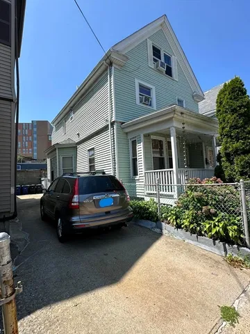 a car parked in front of a house