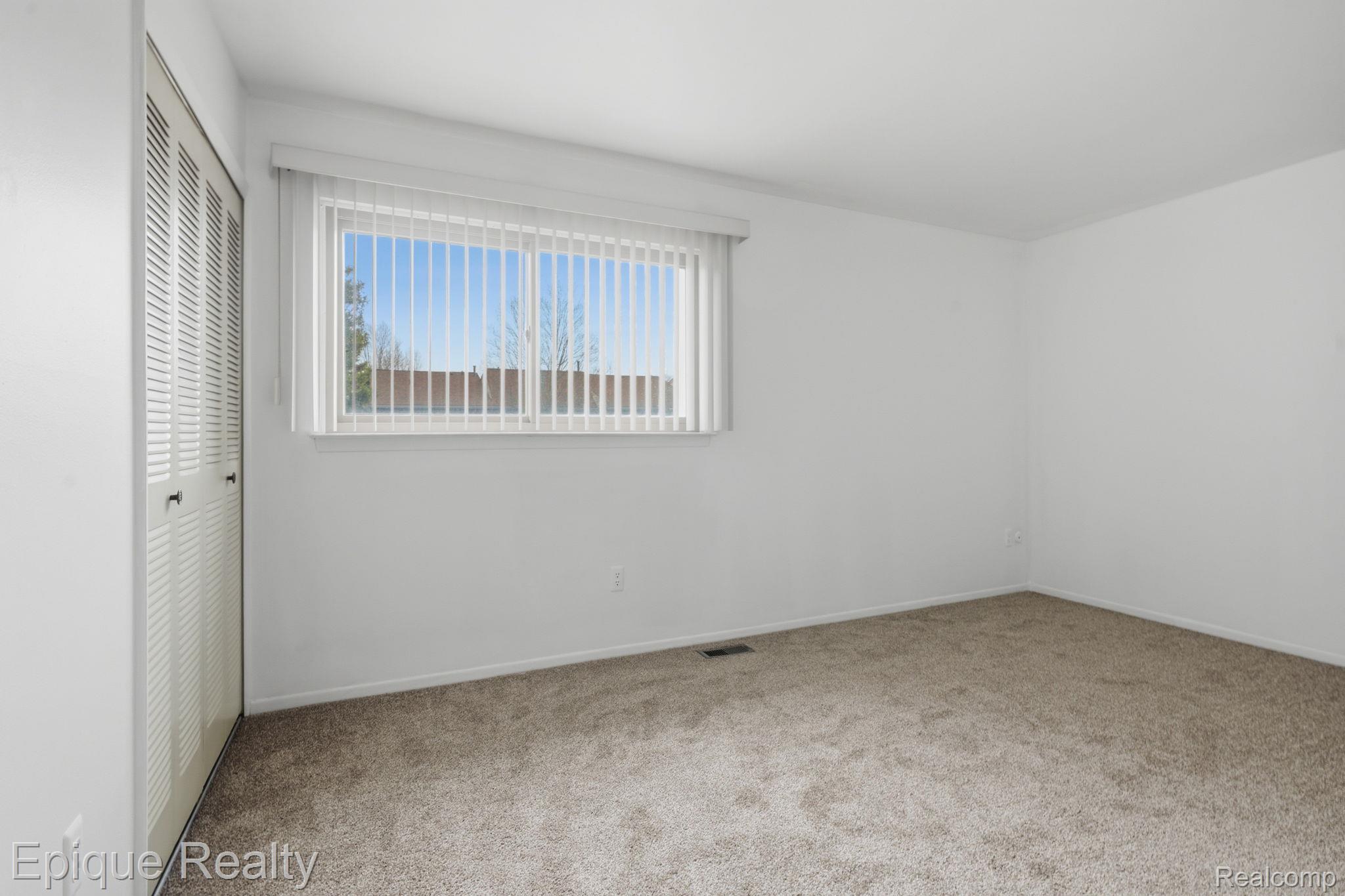 3895 Old Creek Road Troy, MI 48084 - Photo 16 of 23 Unfurnished bedroom with carpet and a closet