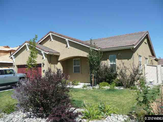 2111 Huntsdale Drive Reno, NV 89521 - Photo 1 of 13 a front view of a house with garden