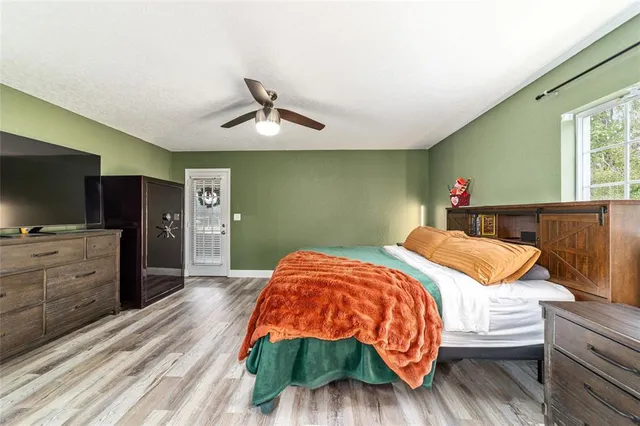 a living room with furniture gym equipment and a window