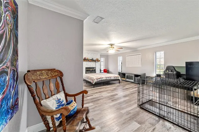 a view of a house with a backyard porch and sitting area
