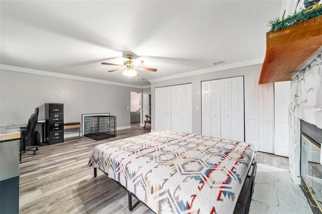 a front view of a house with a garden and yard