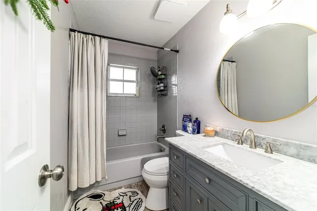 a view of a house with pool and sitting area