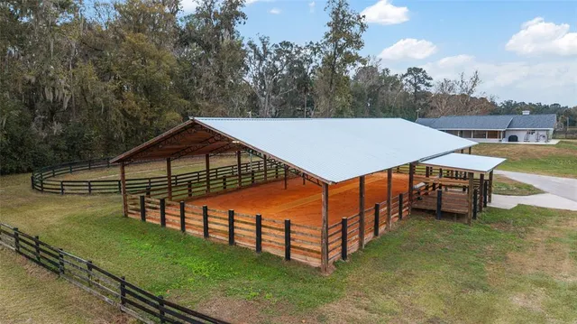 a view of a house with a yard and garage