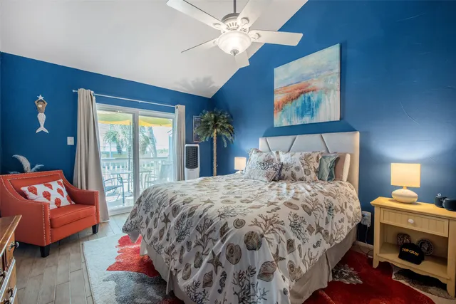 a bedroom with a bed and a couch