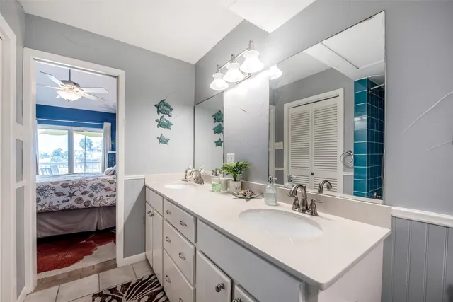a bathroom with a sink double vanity and a mirror